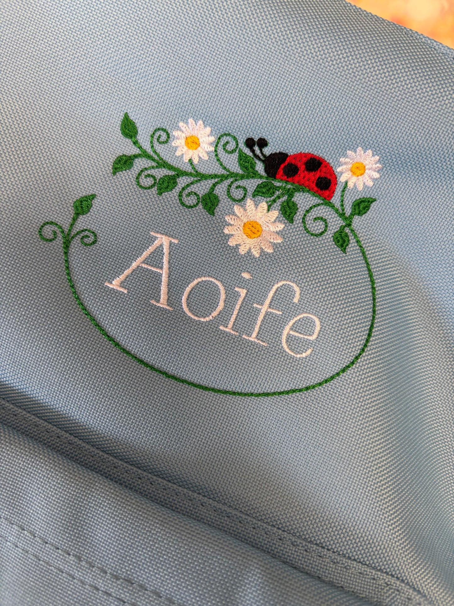 Personalised Nursery / Pre-School mini embroidered rucksack. Choice of colour bag. Childs small rucksack, Ladybird & Flowers Design