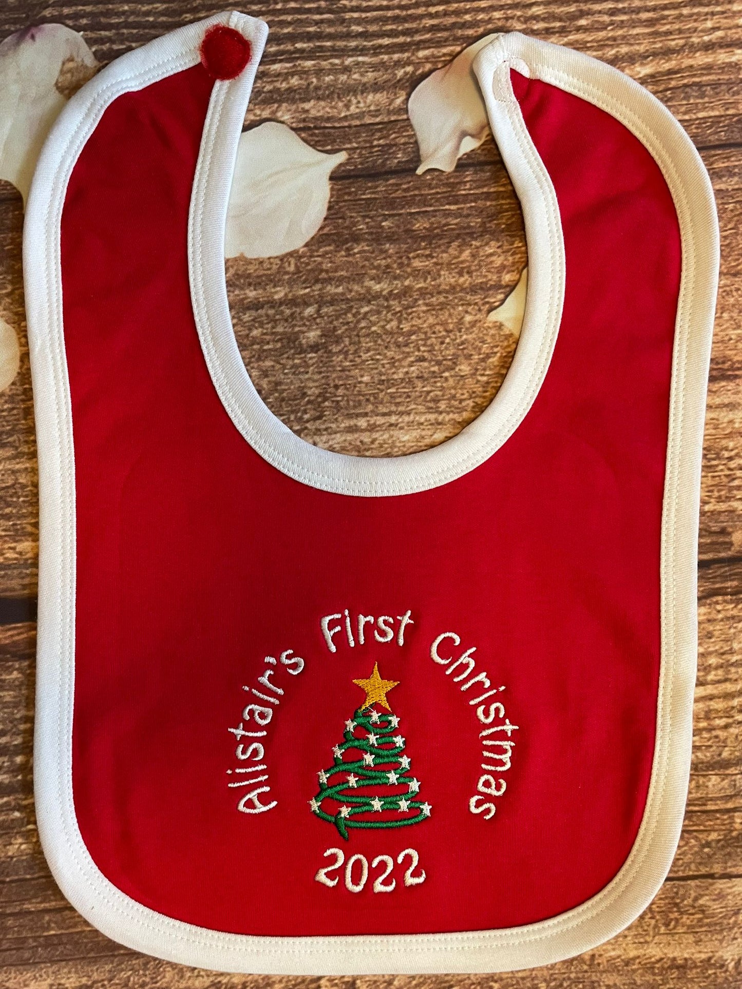 First Christmas bib, embroidered with name, year & choice of Christmas motif. White or red